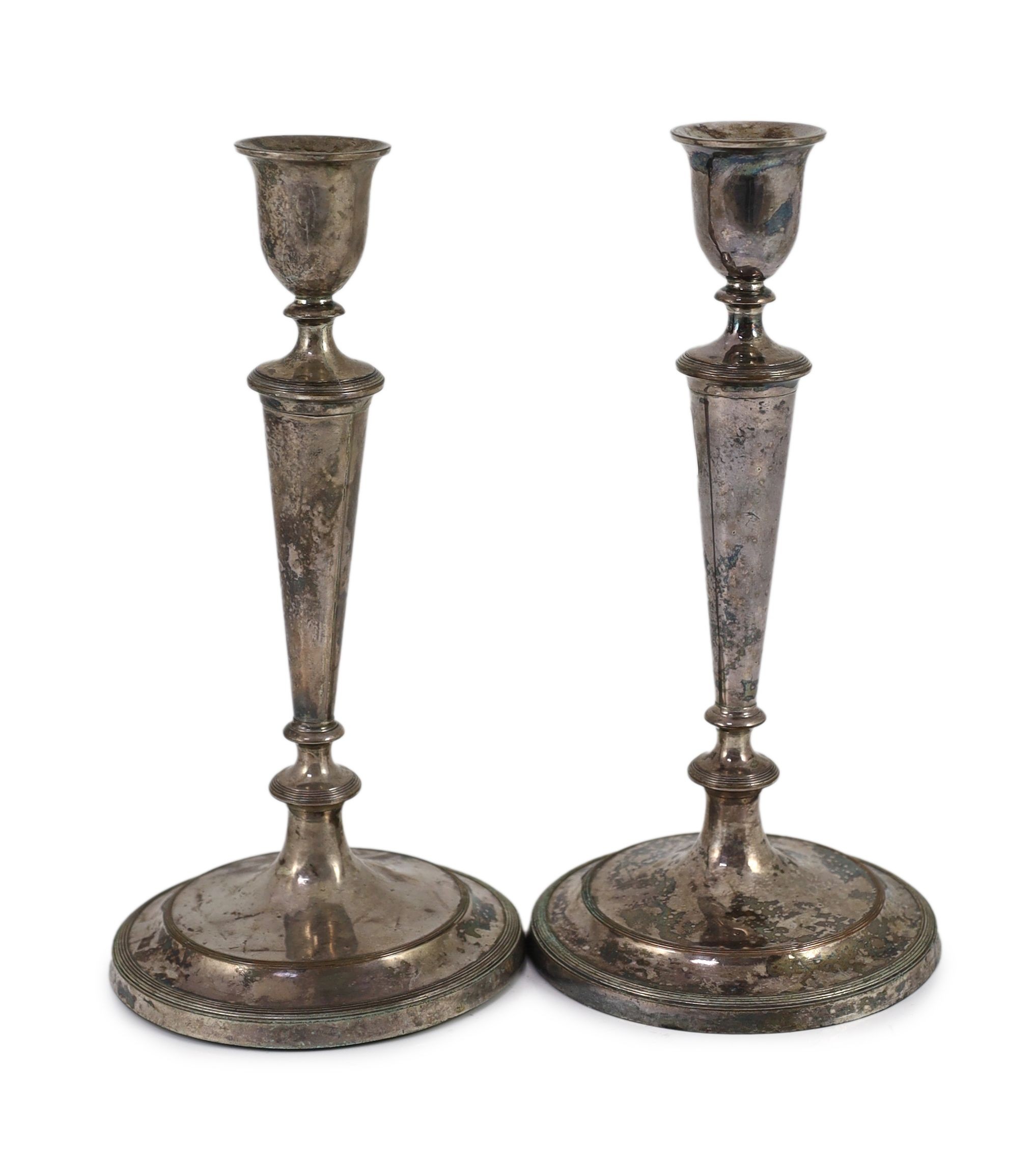 A pair of Sheffield plate candlesticks and nozzles, 26cm high